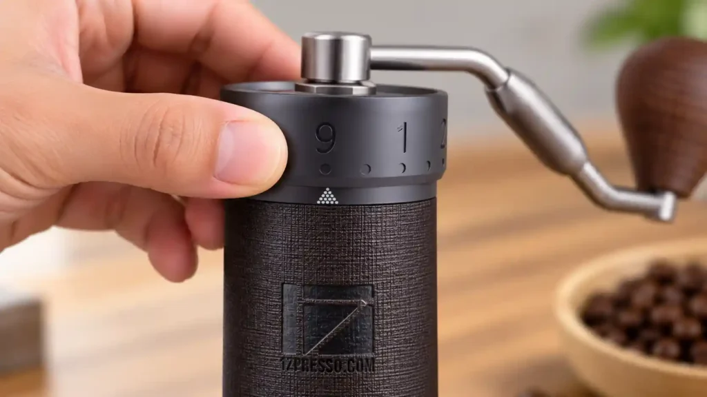 Adjusting the external grind size dial on the 1Zpresso J-Ultra