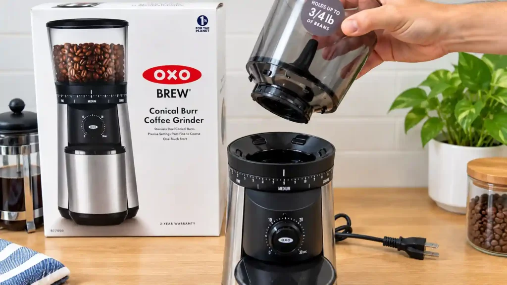 Hands seating the bean hopper on a conical burr grinder